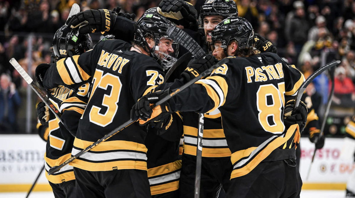 Bruins' defenseman Charlie McAvoy celebrates with his teammates after a score to put the Bruins up by a goal.