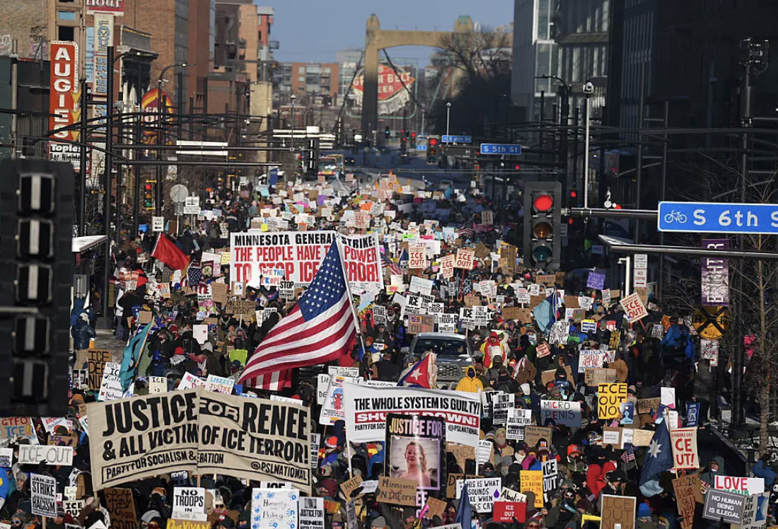 Minneapolis residents take to the streets to protest recent ICE enforcement tactics.
