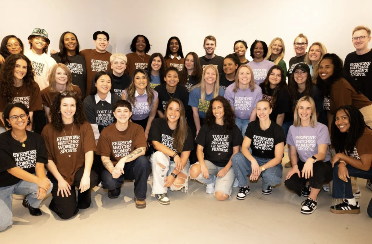 Togethxr's team and cofounders, celebrating their progress with t-shirts in several different languages.