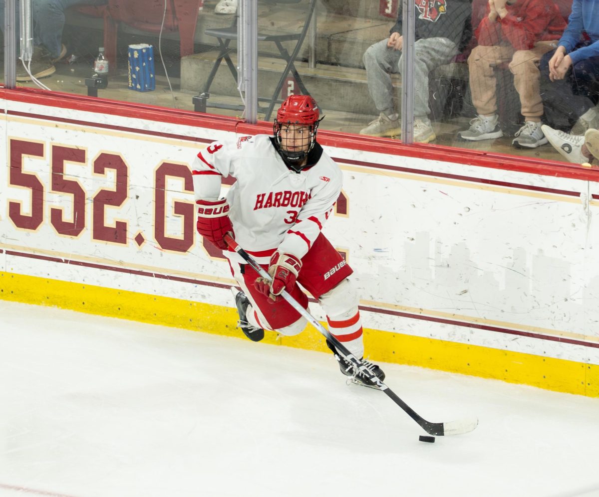 Senior Ryan Laronde skates the puck into the opposing team's area.