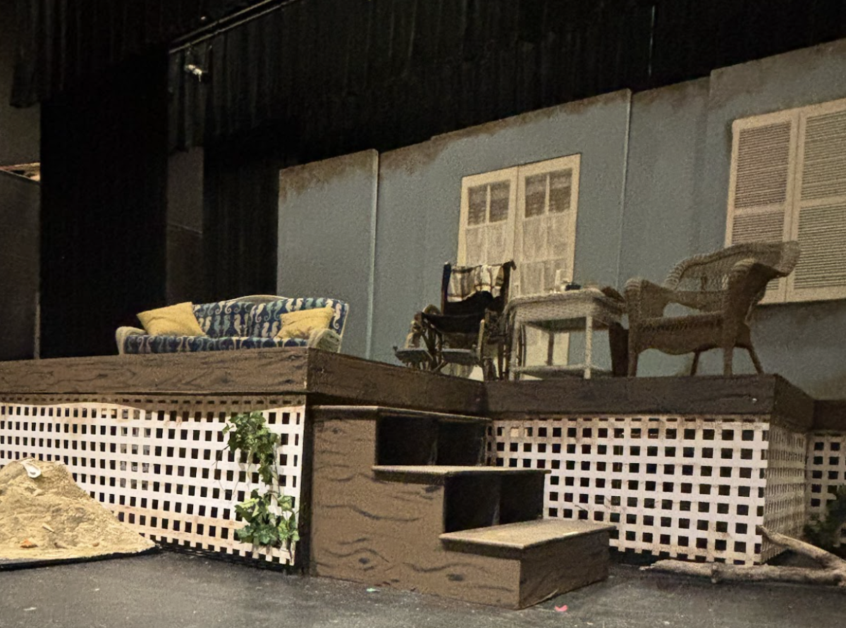 The set was designed by Tag Tomlinson and features artificial weathering and sand to give it a beachy, lived-in feel.