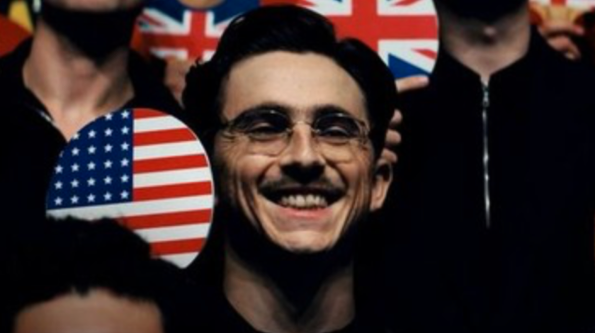 Timothee Chalamet holds up his table tennis paddle as Marty Mauser.