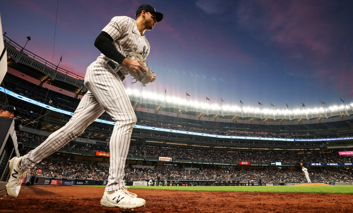 Yankees player Paul Goldshmidt gets ready to take the feel and dominate in a stadium full of MLB fans.