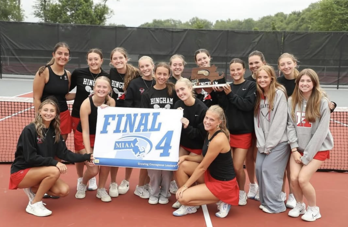 Last season’s Hingham Girls Varsity Tennis team poses with their Final Four trophy and banner, signifying their great season. 
