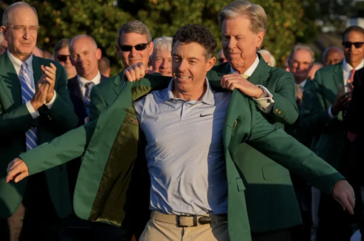 Rory McIlroy is seen directly after winning the Masters, receiving the green jacket award. 