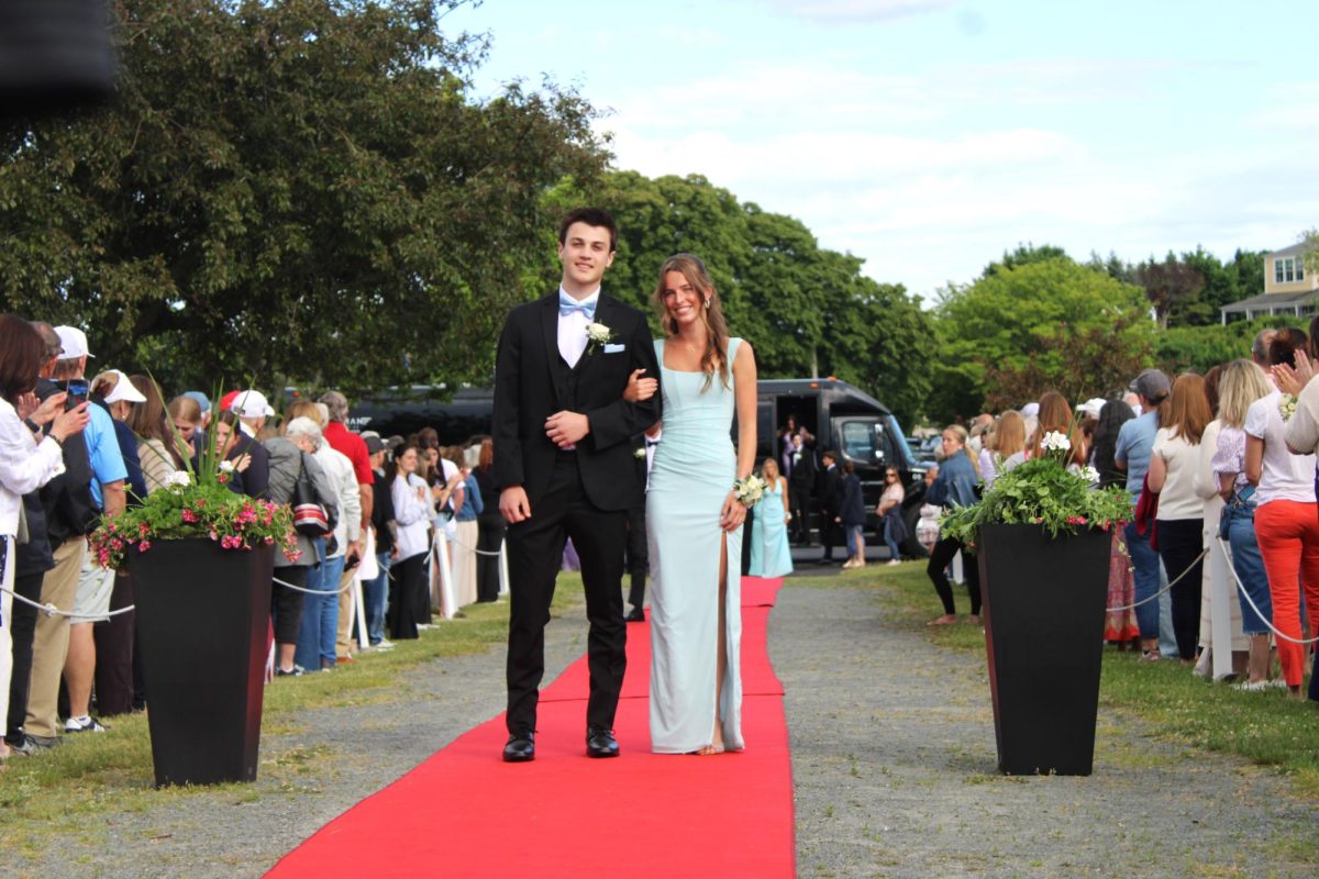 Seniors Finley Erick and Jack Waterbury walk the red carpet.