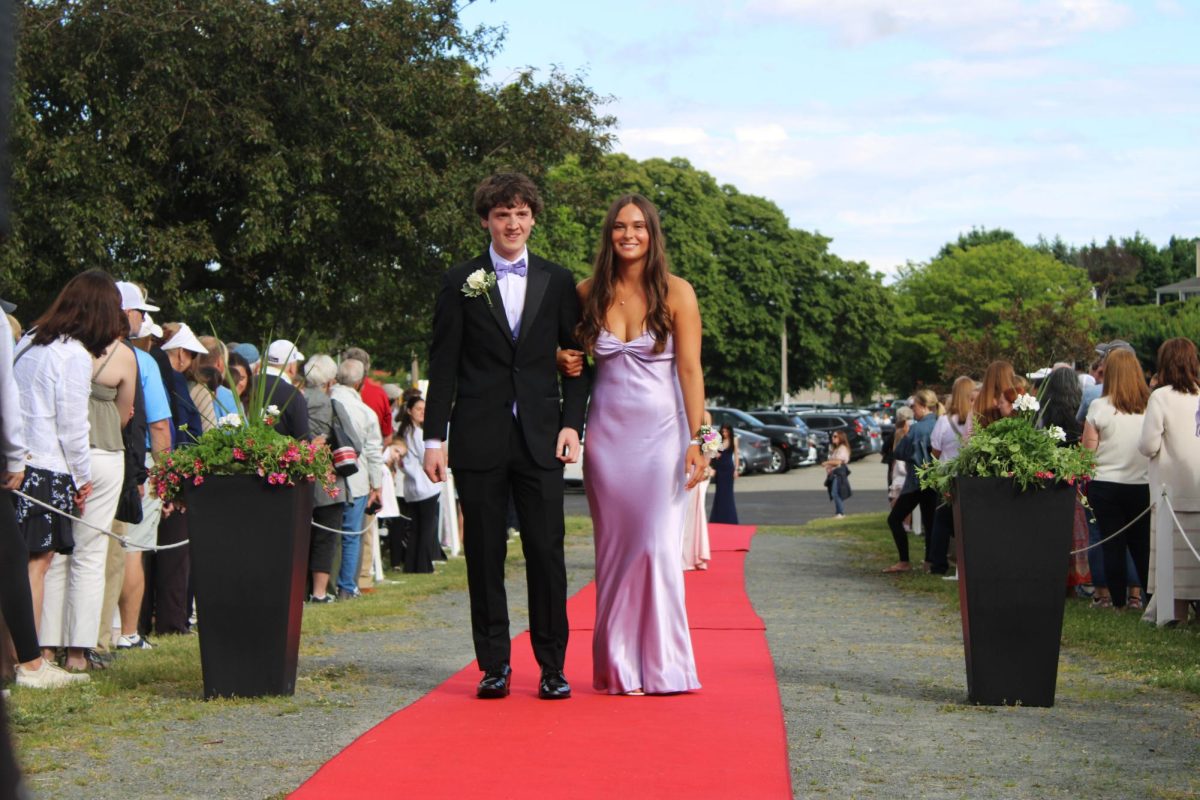Seniors Jeremy Lavoie and Emma Izmirlic walk the red carpet