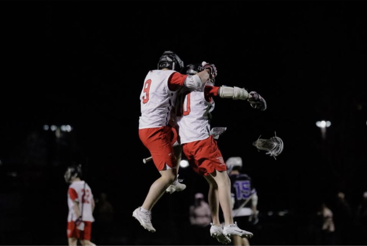 Senior Chase Beighley #9 and Junior Tom McCarthy #10 celebrate a goal in a victory versus Scituate. The Harbormen are the #7 seed in the Boys Lacrosse Division II MIAA Tournament. 