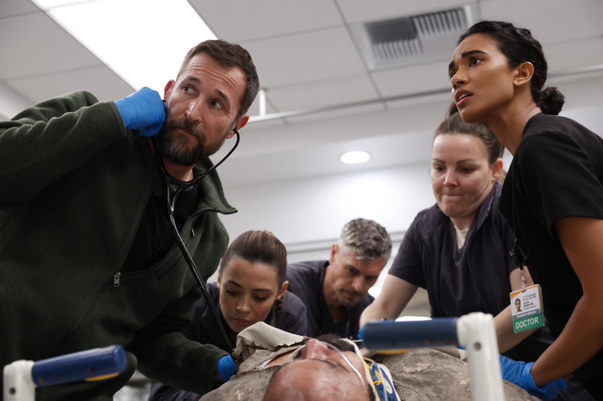 “The Pitt” cast (Noah Wyle, Ned Brower, Ambar Martinez, and Supriya Ganesh) display intense emotions while tending to a patient.