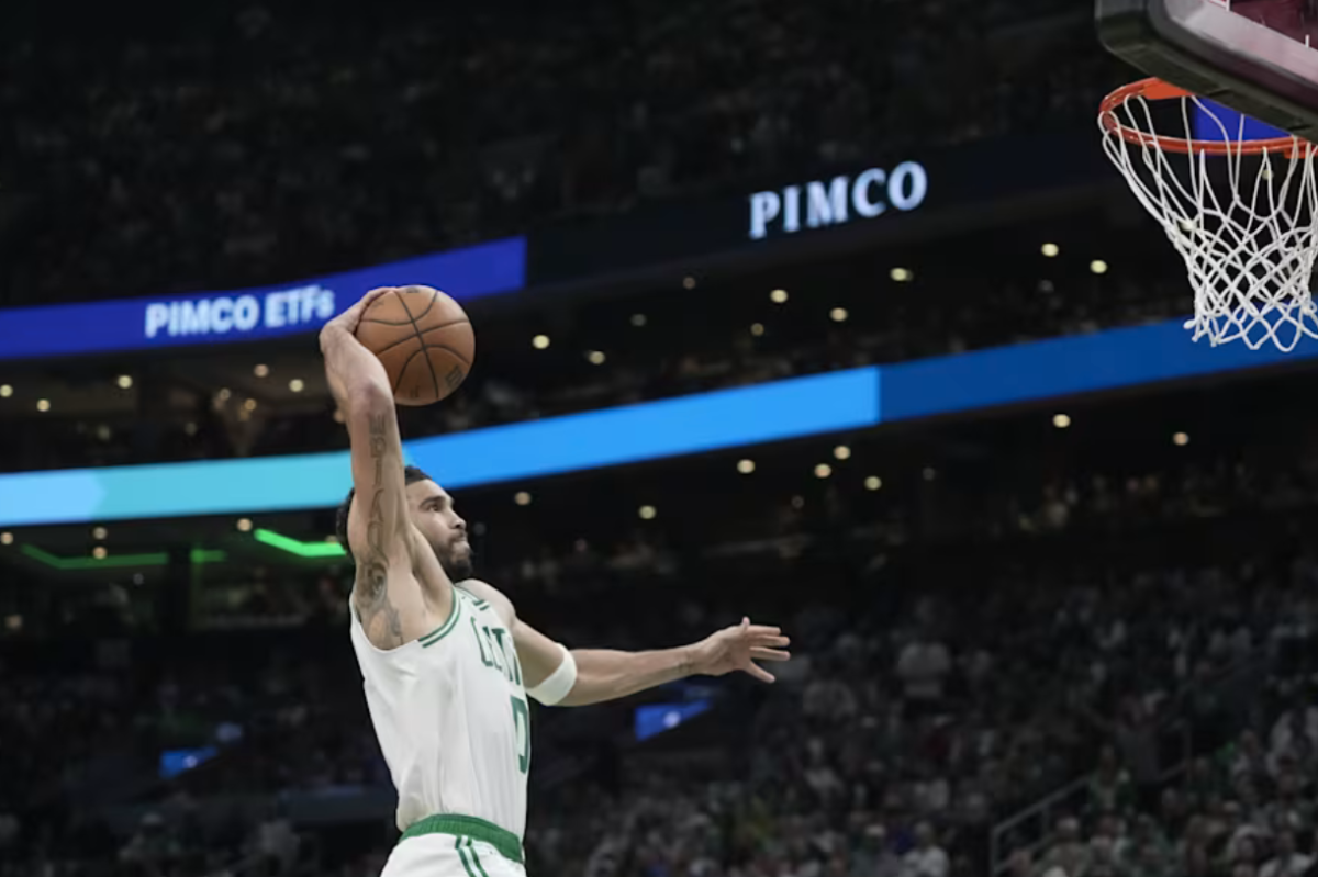 Boston Celtics Jayson Tatum goes for a dunk against the Philadelphia 76ers during Game 1 of the first round of the NBA playoffs on Sunday, April 19, 2026 in Boston.