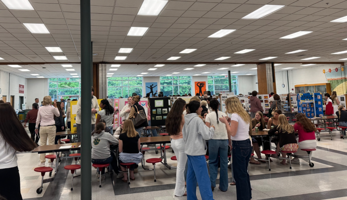 Students and parents browse through the different global presentations during the Symposium.