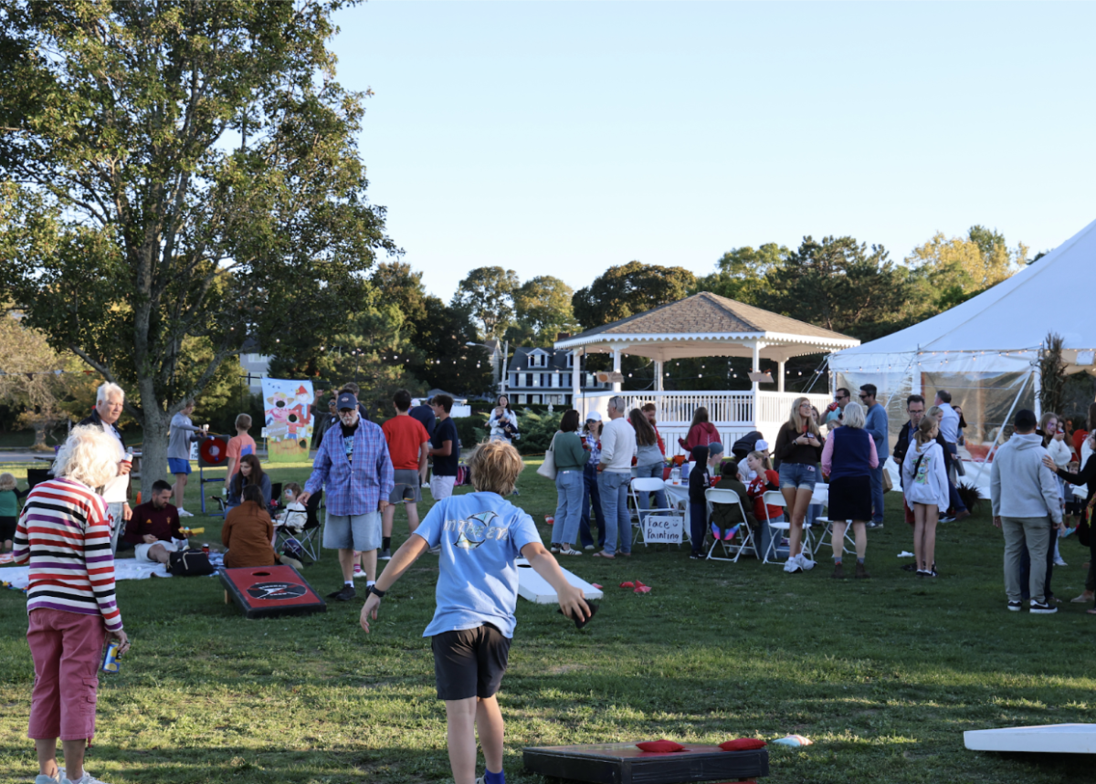 Attendees of Saturday’s Fall Fest enjoy the many activities before the sun sets.