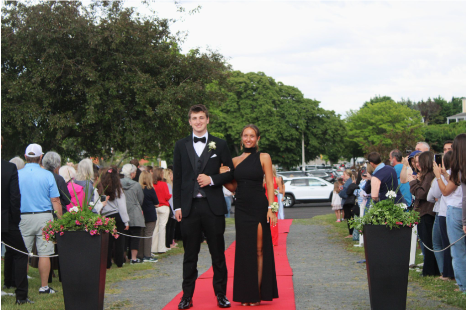 Seniors Cavan Nicholas and Harborlight Editor-in- Chief Caitlin Patten make their war down the red carpet.