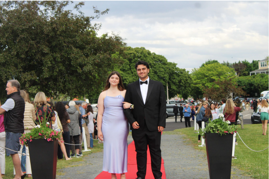 Senior and Harborlight Photo Ediotor, Caio DaSilva and his date pose on the red carpet before heading off to the big dance. 