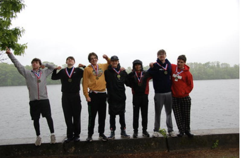 The 4th Varsity boat enjoys a pride-filled victory.