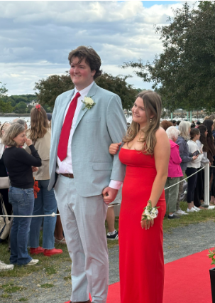 Tommy Hartnett and Olivia Carleton pose for the camera.