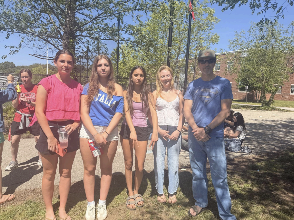 (left to right) Celia Tower, Hailey Catalfono, Evangeline Cain, Bo Wilson, and Mr. George pose for a picture.
