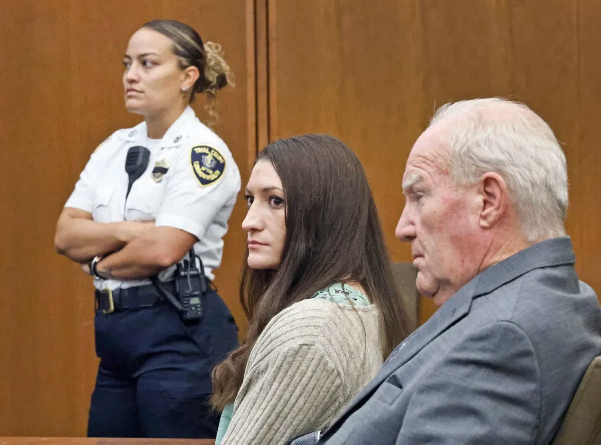 As Judge Sullivan asks the twelve jurors to continue deliberation for the sixth day, Lindsay Clancy looks over at the panel. Sitting next to her, defense attorney Kevin Reddington looks forward after hearing the judge.