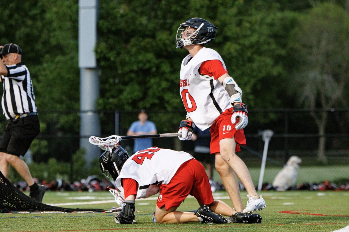 Sophmore Finn Bell and Senior Tom McCarthy celebrate after scoring the game winning goal in the playoffs against Westwood last year.