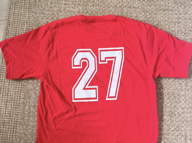 An image capturing what all of the seniors wore to school on their first day back: a red T-shirt with their graduation year on the back.
