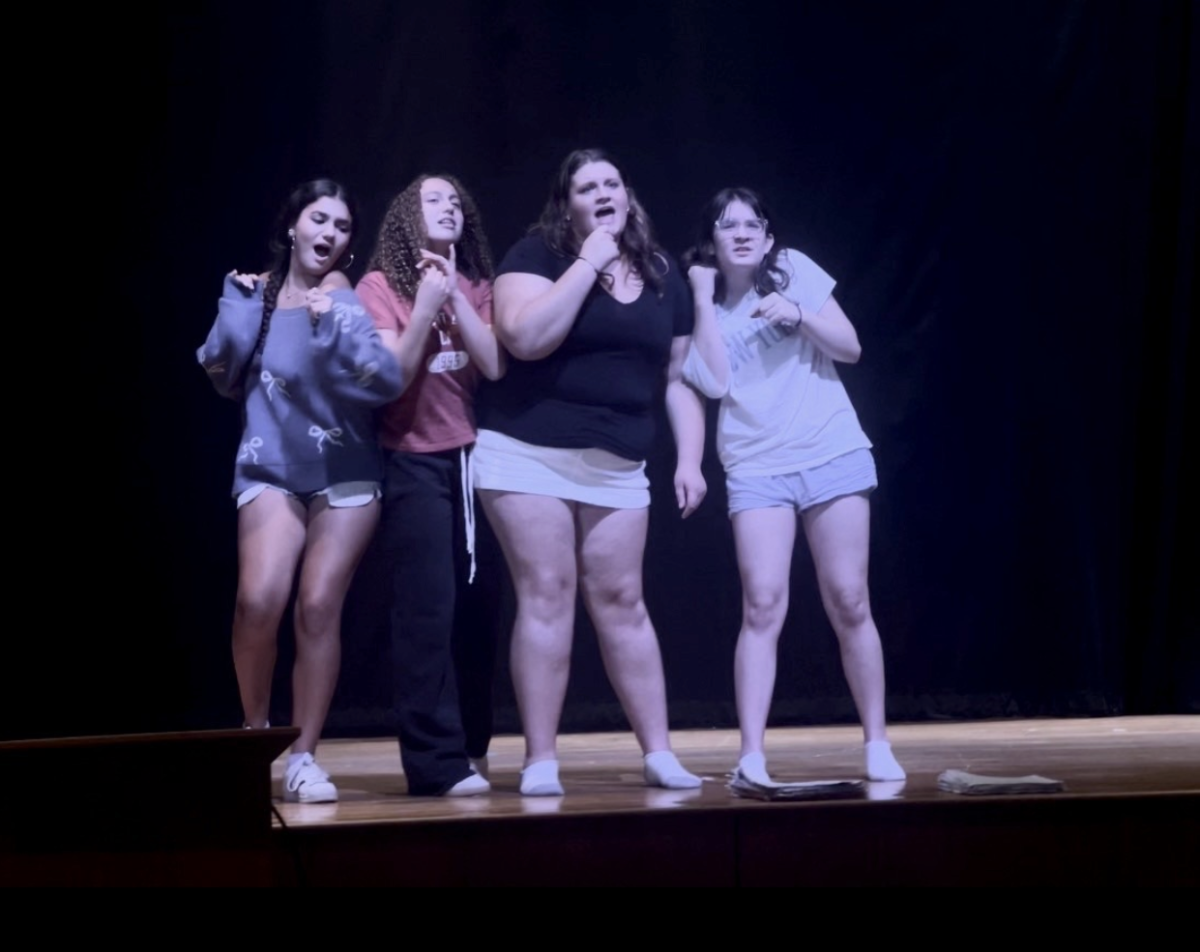 (Left to right) Annabelle Dutra, Ellie Cerrato, Izze Donnelly, and Sadie Stone rehearsing their big opening scene.