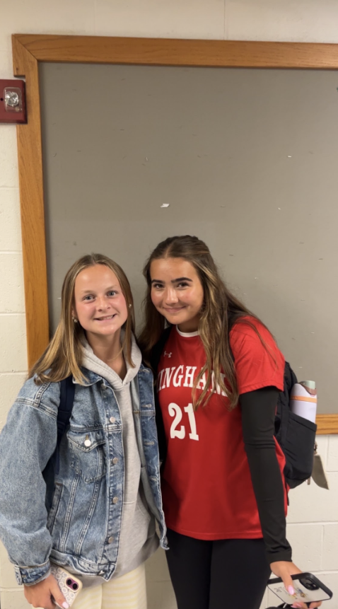 Quinn Hallisey and Charlotte Mercer in the halls of Hingham High School.