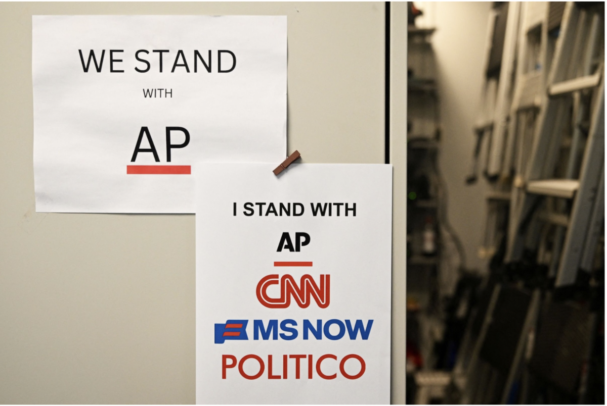 Signage in support of banned media outlets (photo by Alex Wroblewski)
