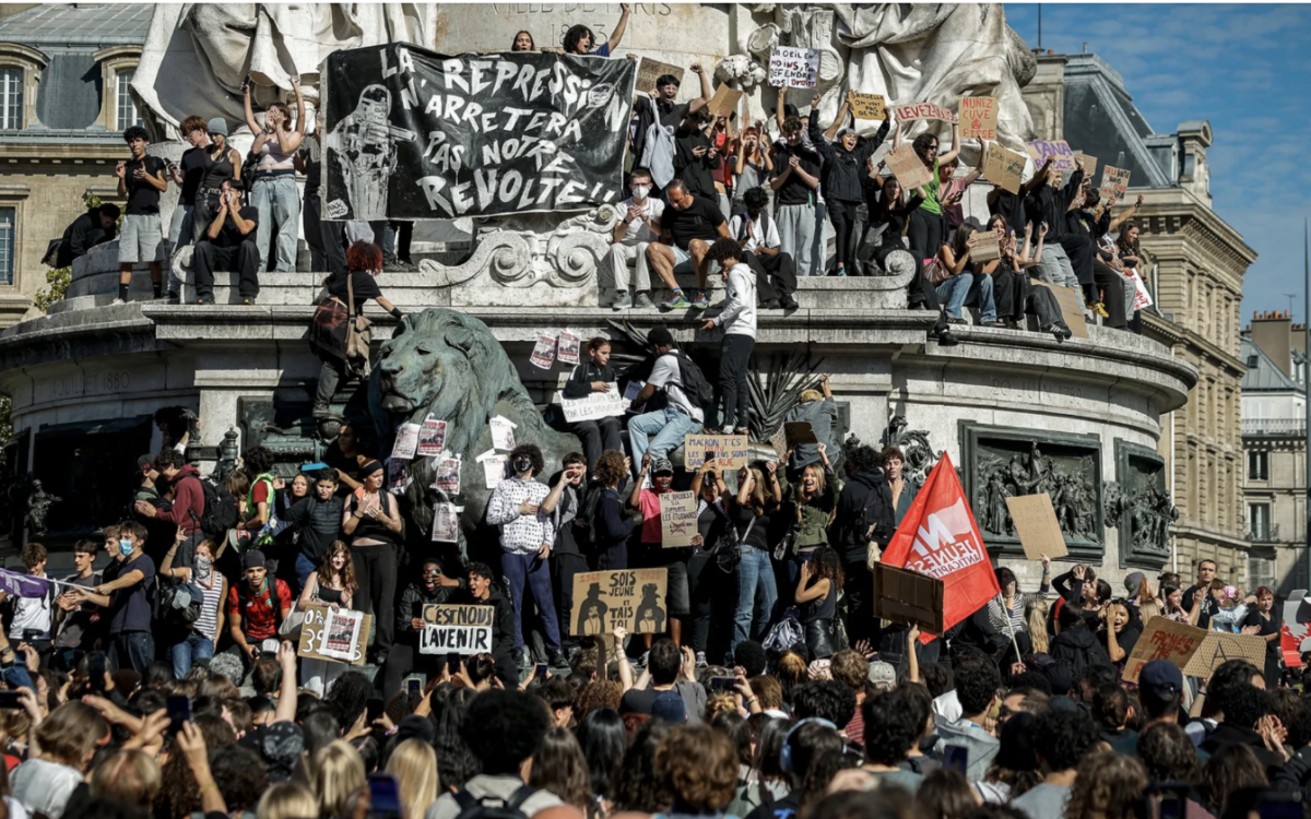 Students in Paris, France congregating with signs to protest for a better education
Photo Credit: Geoffroy Van Der Hasselt