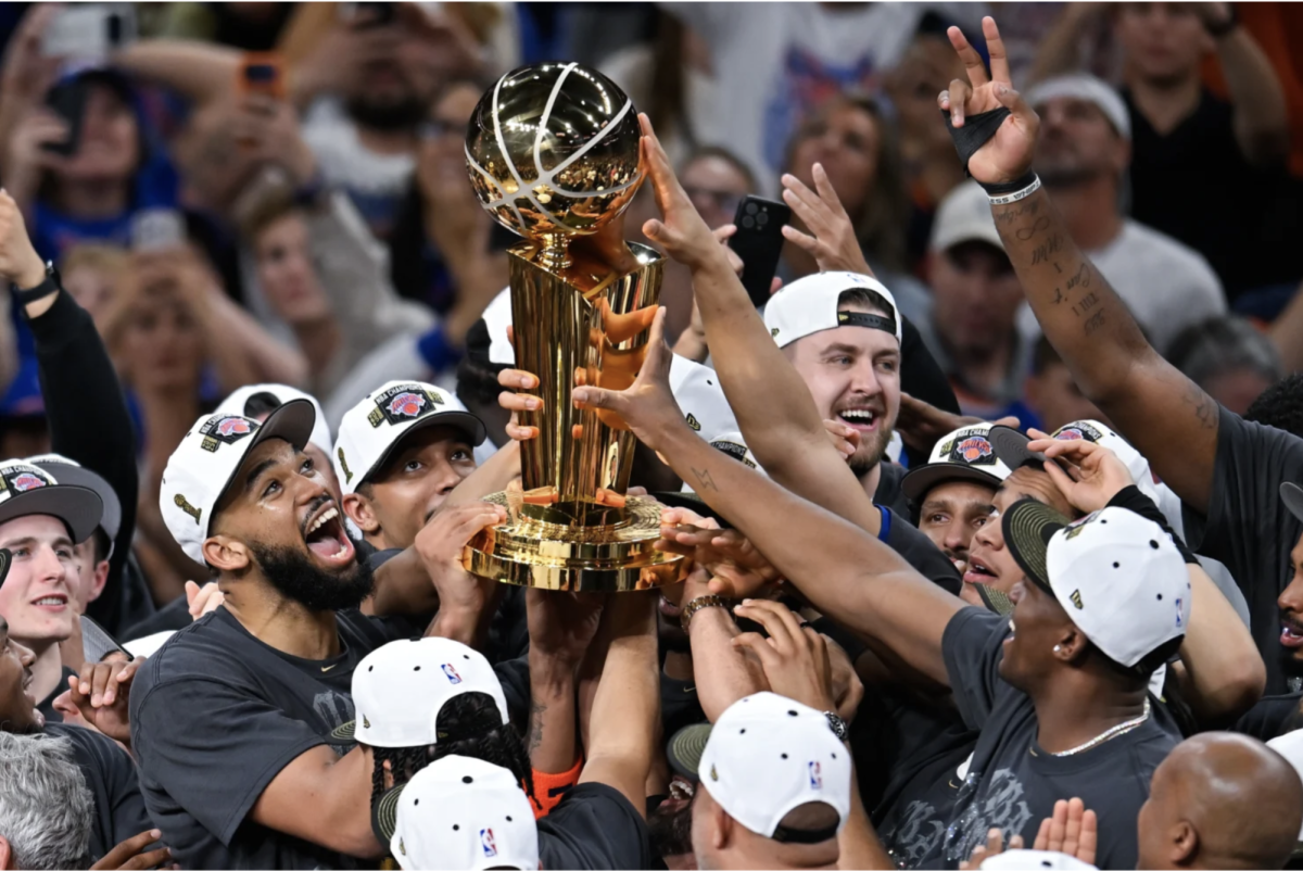 The New York Knicks celebrate after winning Game 5 of the NBA Finals on Saturday, June 13. New York defeated the San Antonio Spurs in five games to win their first championship in 53 years. (photo by Darren Abate)