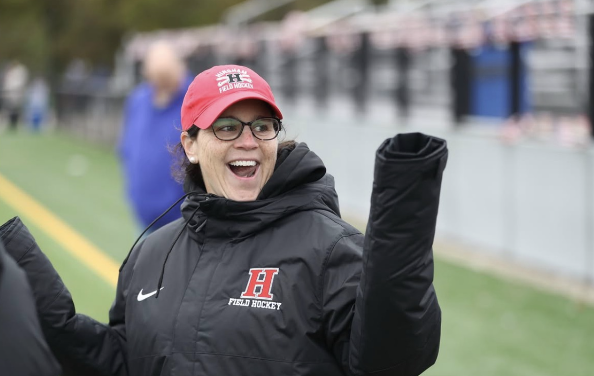 Susan Petrie, better known as Ms. Petrie or Coach Petrie, excitedly celebrates her 250th win. 